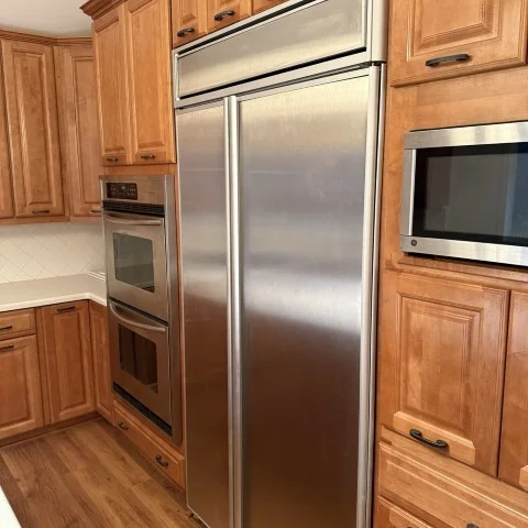 built-in refrigerator installed in custom cabinetry